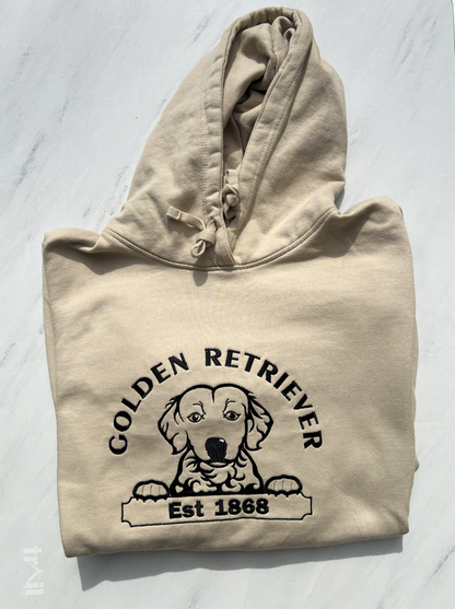 Beige hoodie with Golden Retriever graphic and text on a light gray background