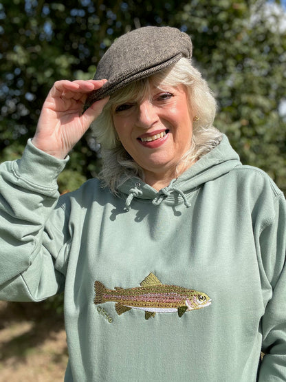 Model wearing the Heritage Earth Rainbow Trout embroidered hoodie